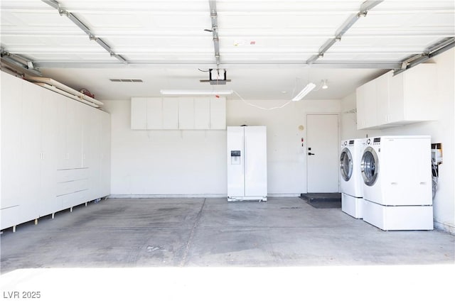 5400 Tassara Way Unit 106, Las Vegas, NV 89108 - garage featuring independent washer and dryer, white refrigerator with ice dispenser, and a garage door opener
