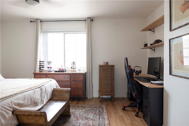 5400 Tassara Way Unit 106, Las Vegas, NV 89108 - bedroom with light wood-style floors and a desk