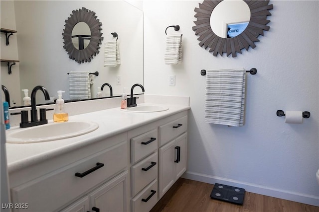 5400 Tassara Way Unit 106, Las Vegas, NV 89108 - bathroom with wood finished floors, baseboards, and double vanity
