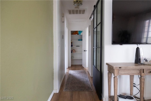 5400 Tassara Way Unit 106, Las Vegas, NV 89108 - hallway with wood finished floors and baseboards