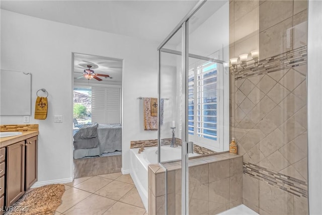 153 Via Di Mello, Henderson, NV 89011 - ensuite bathroom featuring a bath, vanity, a shower stall, a ceiling fan, and tile patterned floors