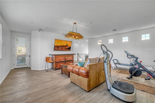 153 Via Di Mello, Henderson, NV 89011 - living area featuring light wood-style flooring and baseboards