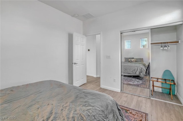 153 Via Di Mello, Henderson, NV 89011 - bedroom with wood finished floors, baseboards, and a closet