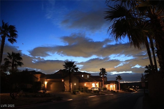 153 Via Di Mello, Henderson, NV 89011 - view of front of house featuring a garage, driveway, and stucco siding