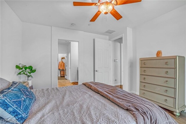 153 Via Di Mello, Henderson, NV 89011 - bedroom with a ceiling fan, wood finished floors, and baseboards