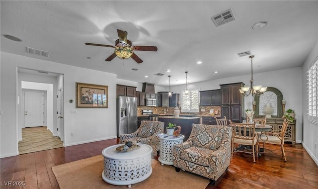 153 Via Di Mello, Henderson, NV 89011 - living area with a ceiling fan, dark wood-type flooring, a chandelier, baseboards, and recessed lighting