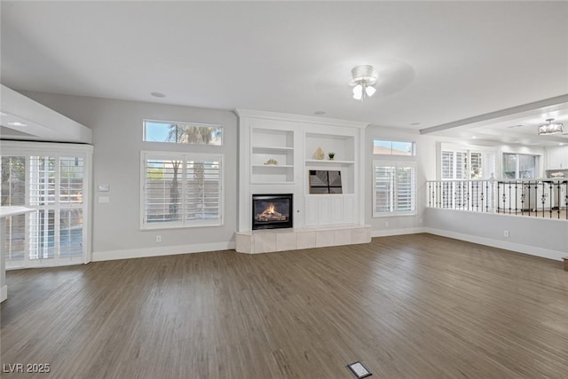 11158 Antonine Wall Ct, Las Vegas, NV 89141 - unfurnished living room featuring wood finished floors, baseboards, a fireplace, and a ceiling fan
