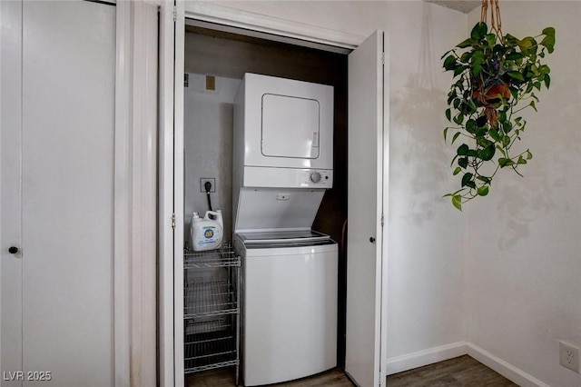 227 N Lamb Blvd Unit B, Las Vegas, NV 89110 - washroom featuring stacked washer / drying machine, wood finished floors, and baseboards