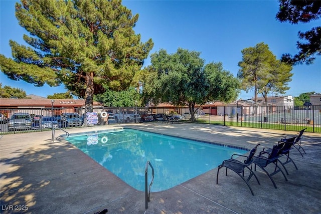 227 N Lamb Blvd Unit B, Las Vegas, NV 89110 - community pool with fence and a patio area