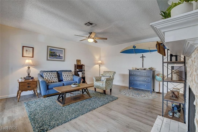 227 N Lamb Blvd Unit B, Las Vegas, NV 89110 - living room with wood finished floors, a ceiling fan, baseboards, and a textured ceiling