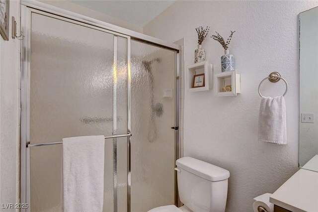 227 N Lamb Blvd Unit B, Las Vegas, NV 89110 - bathroom featuring toilet, vanity, and a stall shower