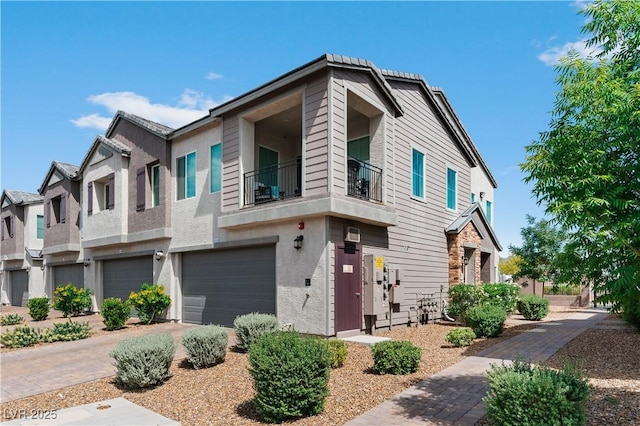 3729 Canis Minor Ln Unit 10206, Henderson, NV 89052 - multi unit property with an attached garage, a balcony, and stucco siding