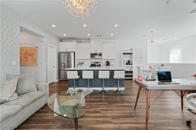 3729 Canis Minor Ln Unit 10206, Henderson, NV 89052 - living area with a chandelier, dark wood-type flooring, recessed lighting, and baseboards