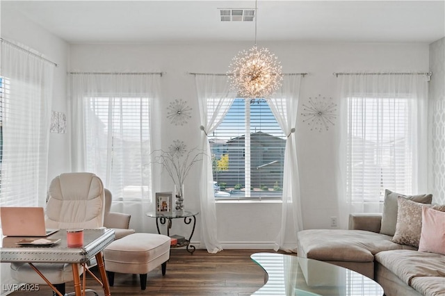 3729 Canis Minor Ln Unit 10206, Henderson, NV 89052 - sitting room with wood finished floors, a chandelier, and baseboards