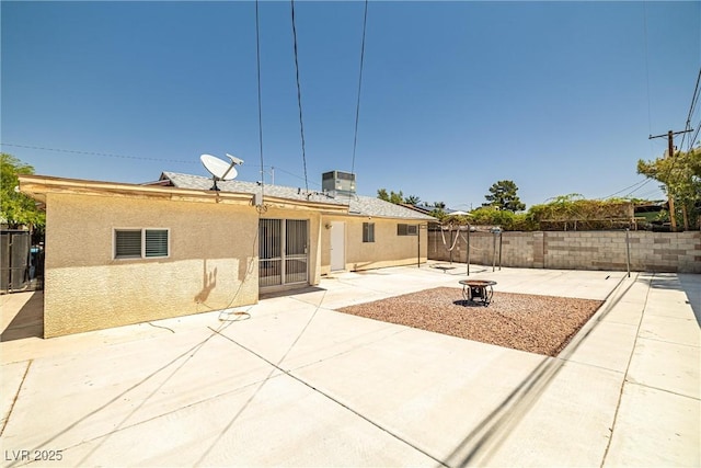 5817 Glen Eagles Ln, Las Vegas, NV 89108 - back of property featuring stucco siding, a patio area, and a fenced backyard