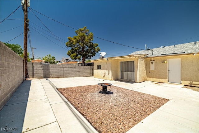 5817 Glen Eagles Ln, Las Vegas, NV 89108 - fenced backyard with a patio area and an outdoor fire pit
