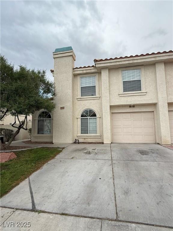 7969 Cina Ave, Las Vegas, NV 89147 - view of front of house with driveway, a garage, and stucco siding