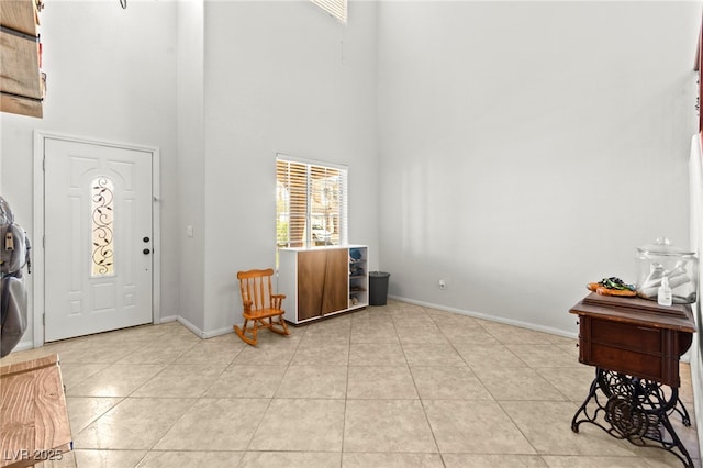 7641 Lani Dawn St, Las Vegas, NV 89149 - entrance foyer with a towering ceiling, light tile patterned floors, and baseboards