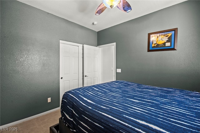 7641 Lani Dawn St, Las Vegas, NV 89149 - carpeted bedroom featuring a textured wall, baseboards, and ceiling fan