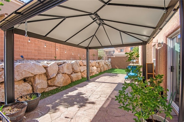 7641 Lani Dawn St, Las Vegas, NV 89149 - view of patio / terrace with a fenced backyard and a gazebo