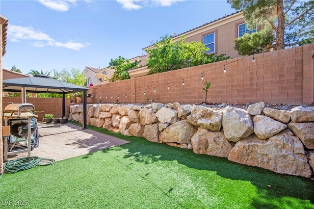 7641 Lani Dawn St, Las Vegas, NV 89149 - fenced backyard with a patio area and a gazebo