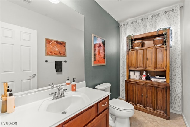 7641 Lani Dawn St, Las Vegas, NV 89149 - bathroom featuring toilet, tile patterned flooring, and vanity