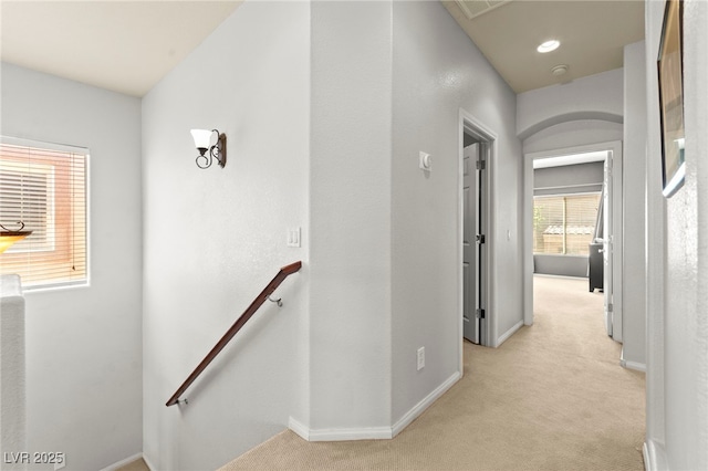 7641 Lani Dawn St, Las Vegas, NV 89149 - hallway with an upstairs landing, light carpet, and baseboards