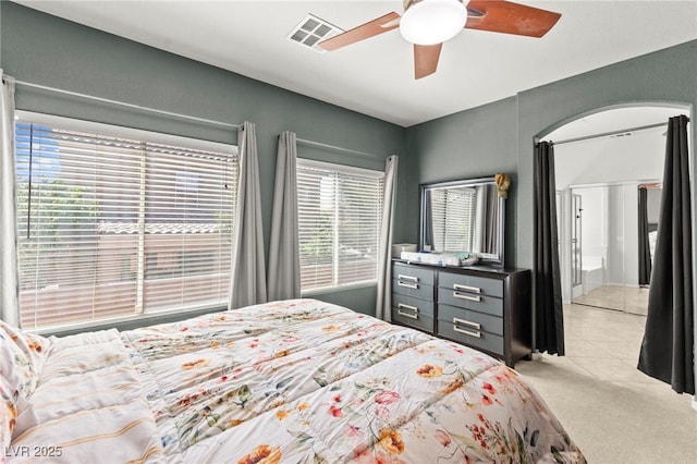7641 Lani Dawn St, Las Vegas, NV 89149 - carpeted bedroom with a ceiling fan and tile patterned flooring