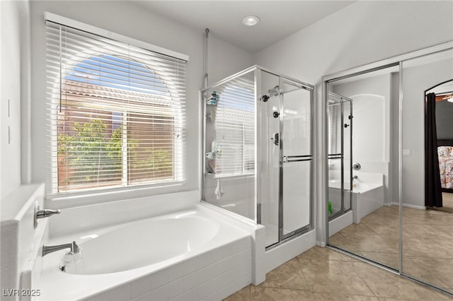 7641 Lani Dawn St, Las Vegas, NV 89149 - bathroom with a shower stall, a garden tub, and tile patterned flooring