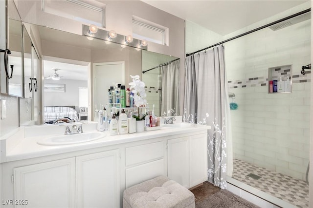 1360 Angel Falls St, Las Vegas, NV 89142 - ensuite bathroom with tiled shower, double vanity, and ceiling fan
