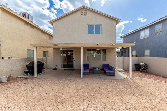 1360 Angel Falls St, Las Vegas, NV 89142 - rear view of house featuring stucco siding, a patio, and a fenced backyard