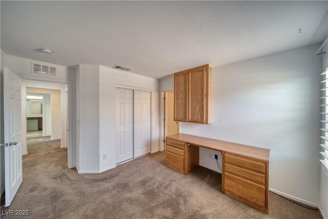 5460 Chippewa, Pahrump, NV 89061 - unfurnished office with light carpet, built in study area, and baseboards