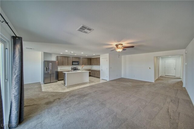 5460 Chippewa, Pahrump, NV 89061 - kitchen with stainless steel appliances, open floor plan, ceiling fan, light carpet, and recessed lighting