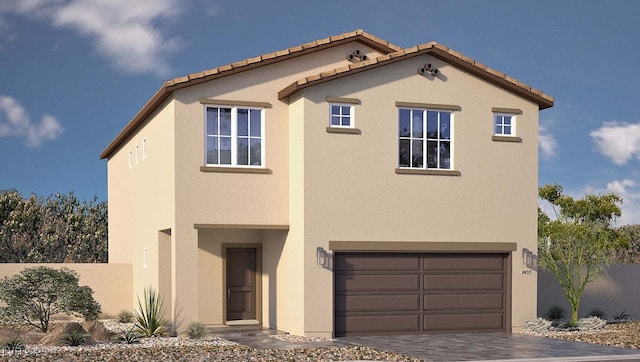 view of front of house featuring fence, a garage, stucco siding, and driveway
