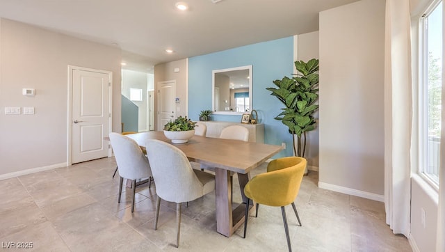 dining area with baseboards, healthy amount of natural light, recessed lighting, and light tile patterned floors