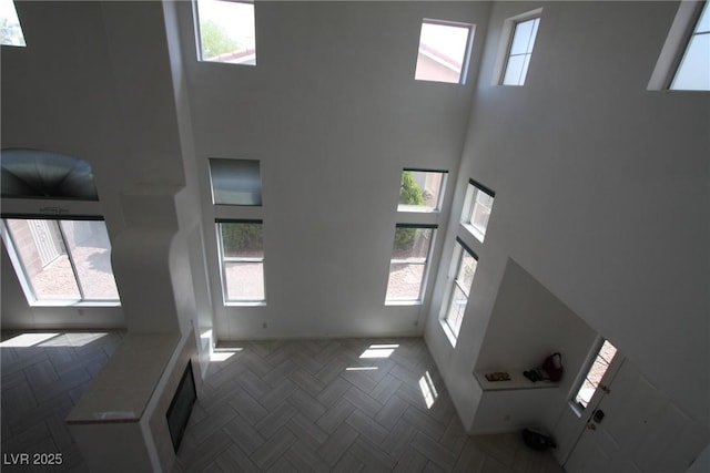 3440 Crystal Tower St, Las Vegas, NV 89129 - unfurnished living room featuring a towering ceiling