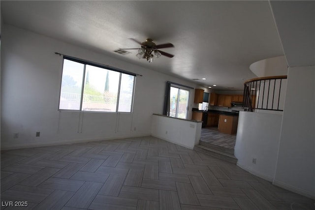 3440 Crystal Tower St, Las Vegas, NV 89129 - unfurnished living room featuring ceiling fan, baseboards, and recessed lighting