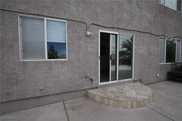 3440 Crystal Tower St, Las Vegas, NV 89129 - entrance to property featuring a patio and stucco siding