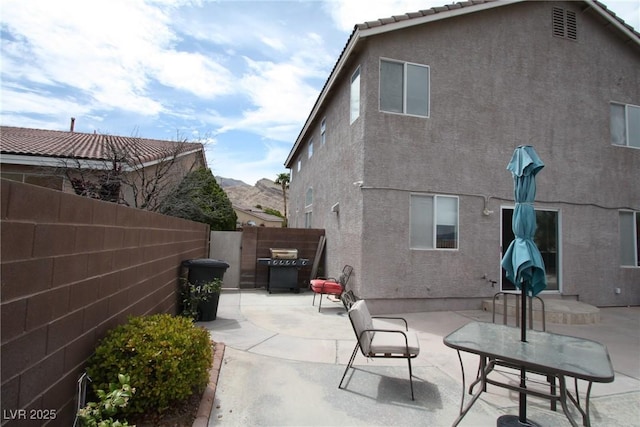 3440 Crystal Tower St, Las Vegas, NV 89129 - back of house featuring a fenced backyard, stucco siding, and a patio