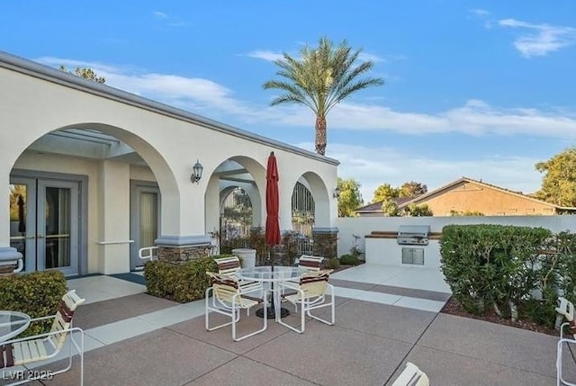 3440 Crystal Tower St, Las Vegas, NV 89129 - view of patio with area for grilling, french doors, and outdoor dining area