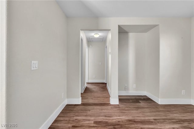 7632 Calico Fields St, Las Vegas, NV 89149 - spare room with wood finished floors, baseboards, and attic access
