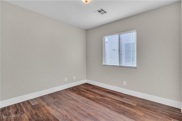 7632 Calico Fields St, Las Vegas, NV 89149 - unfurnished room with baseboards and dark wood-type flooring