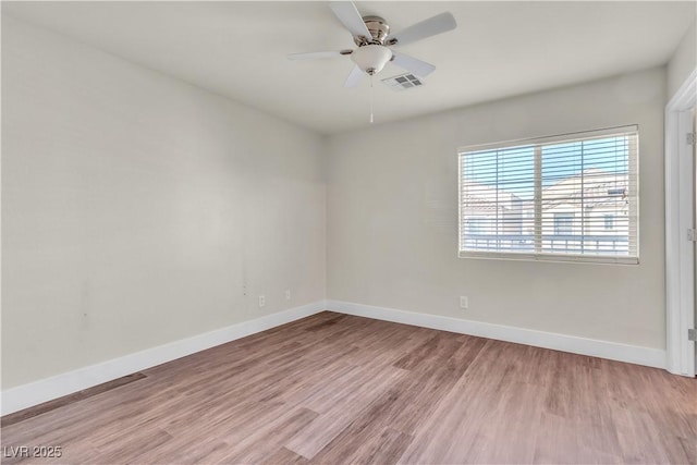 7632 Calico Fields St, Las Vegas, NV 89149 - spare room featuring baseboards, wood finished floors, and ceiling fan