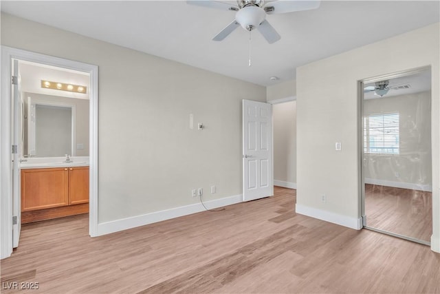7632 Calico Fields St, Las Vegas, NV 89149 - unfurnished bedroom with light wood finished floors, baseboards, a sink, and ensuite bath