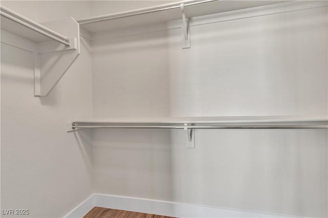 7632 Calico Fields St, Las Vegas, NV 89149 - walk in closet with wood finished floors