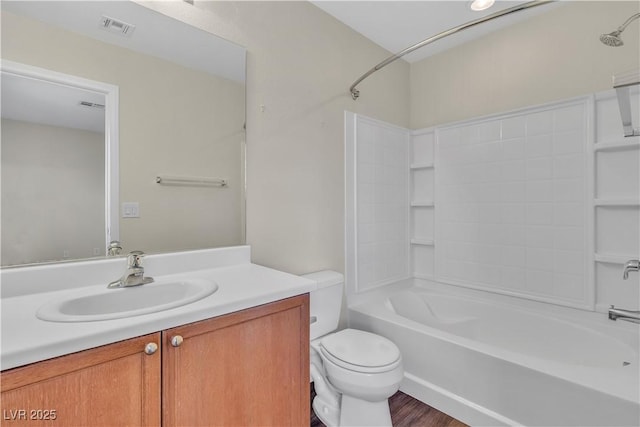 7632 Calico Fields St, Las Vegas, NV 89149 - full bath featuring toilet,  shower combination, vanity, and wood finished floors