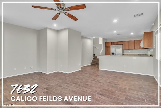 7632 Calico Fields St, Las Vegas, NV 89149 - unfurnished living room featuring a ceiling fan, recessed lighting, light wood finished floors, baseboards, and stairs