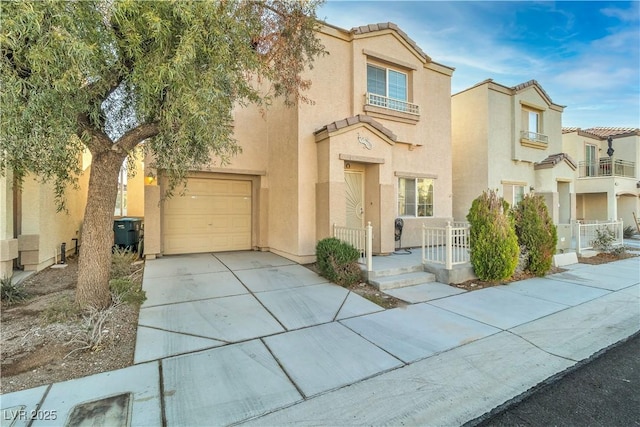7632 Calico Fields St, Las Vegas, NV 89149 - multi unit property featuring concrete driveway, stucco siding, a tiled roof, and an attached garage