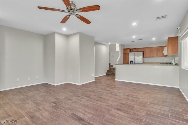 7632 Calico Fields St, Las Vegas, NV 89149 - unfurnished living room with recessed lighting, a ceiling fan, light wood finished floors, baseboards, and plenty of natural light