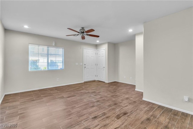 7632 Calico Fields St, Las Vegas, NV 89149 - empty room featuring a ceiling fan, wood finished floors, baseboards, and recessed lighting